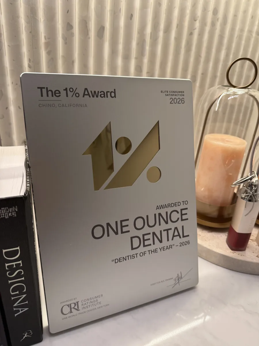 The Consumer Ratings Institute 1% Award plaque presented to One Ounce Dental — "Dentist of the Year" 2026