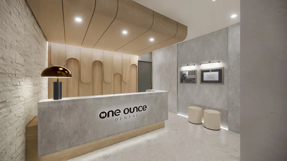 One Ounce Dental Reception Area, Chino, CA One Ounce Dental reception area with a branded front desk, warm wood accents, and modern lighting in Chino, CA